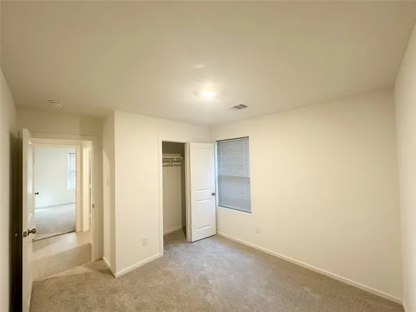 an empty room with a bathroom