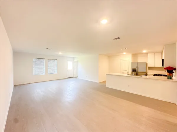 a view of a kitchen with a sink and cabinets