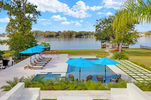 a view of a swimming pool with a patio