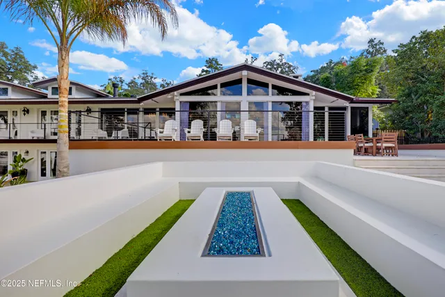 a bathroom with a granite countertop sink a mirror and a shower