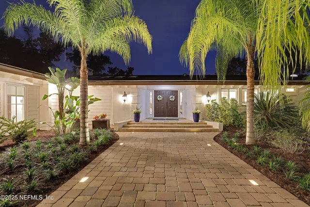 a view of a kitchen with furniture and staircase