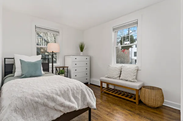 a bedroom with a bed and a dresser