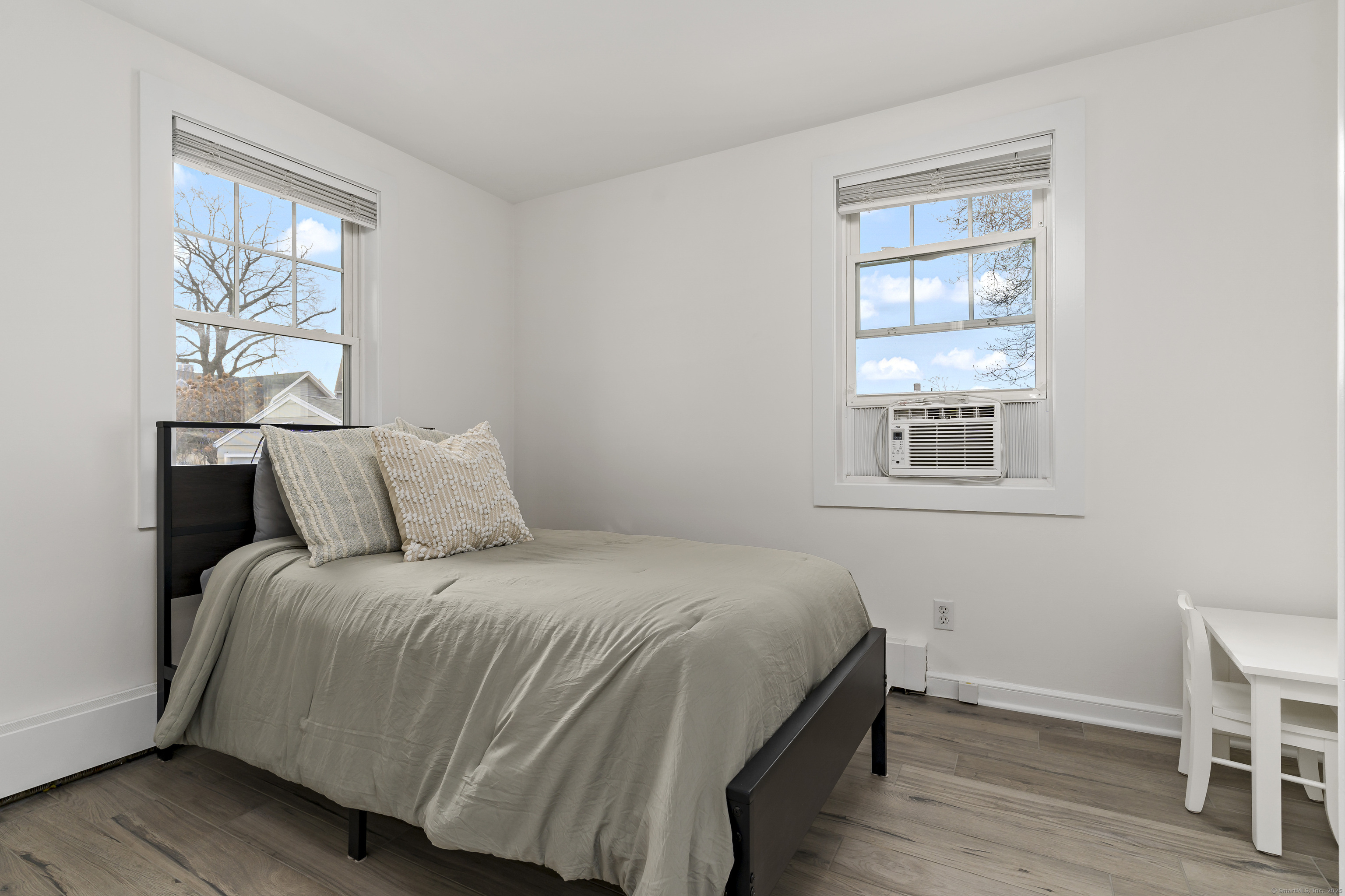 788 Reef Road Fairfield, CT 06824 - Photo 15 of 17 a bedroom with a bed and a window