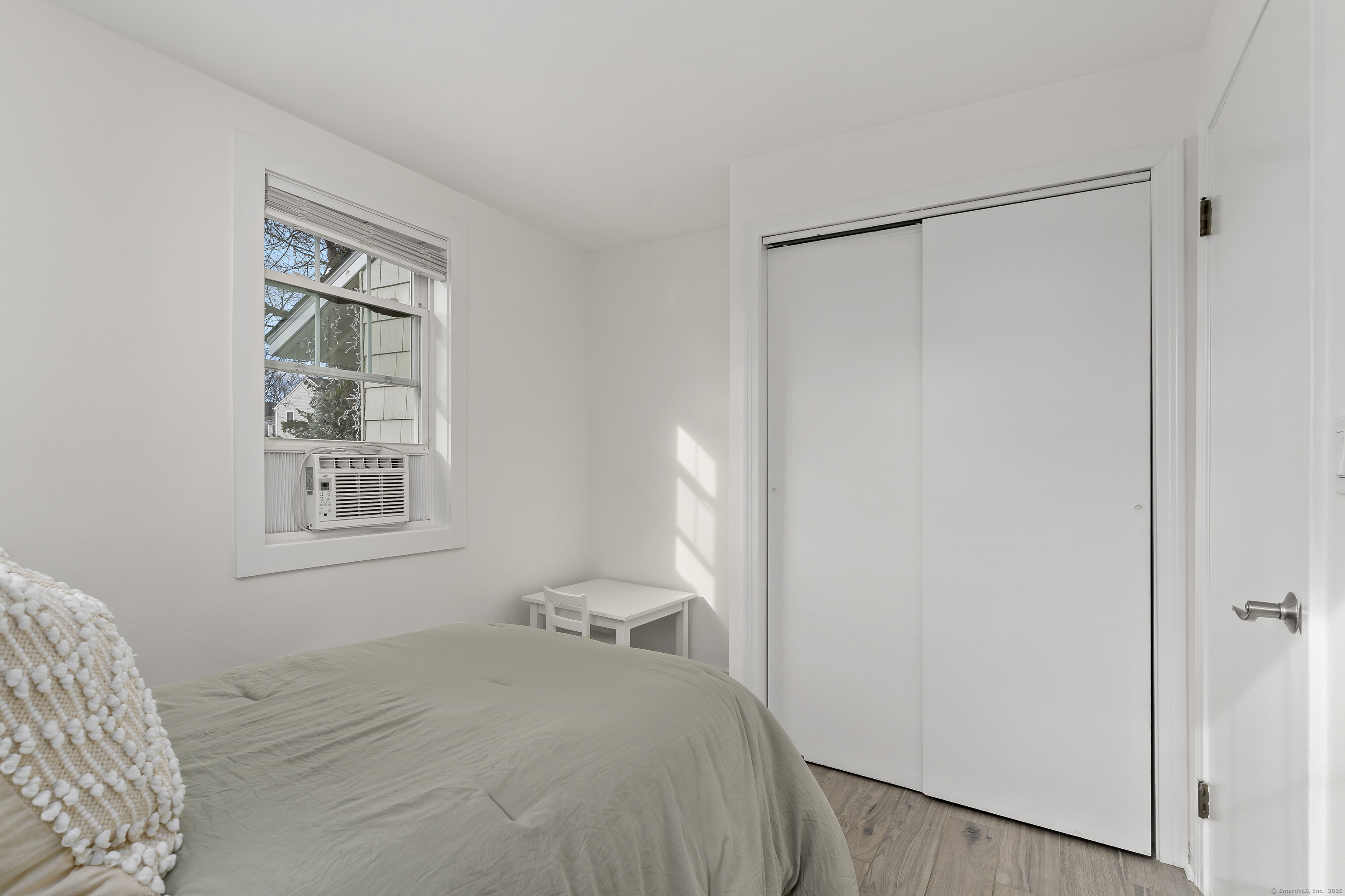 788 Reef Road Fairfield, CT 06824 - Photo 16 of 17 a bedroom with a bed and a window