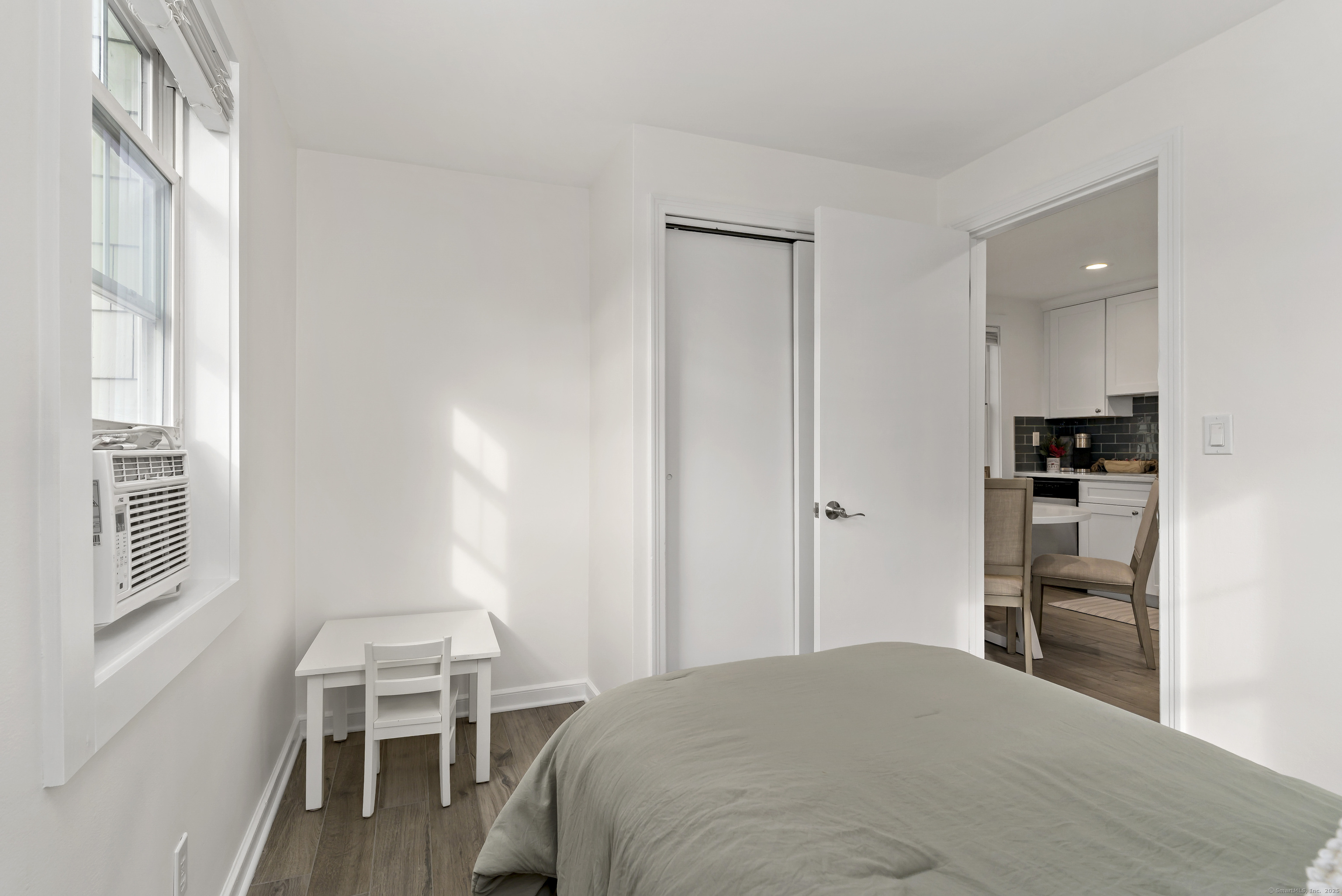 788 Reef Road Fairfield, CT 06824 - Photo 17 of 17 a bedroom with a bed and a chair in it