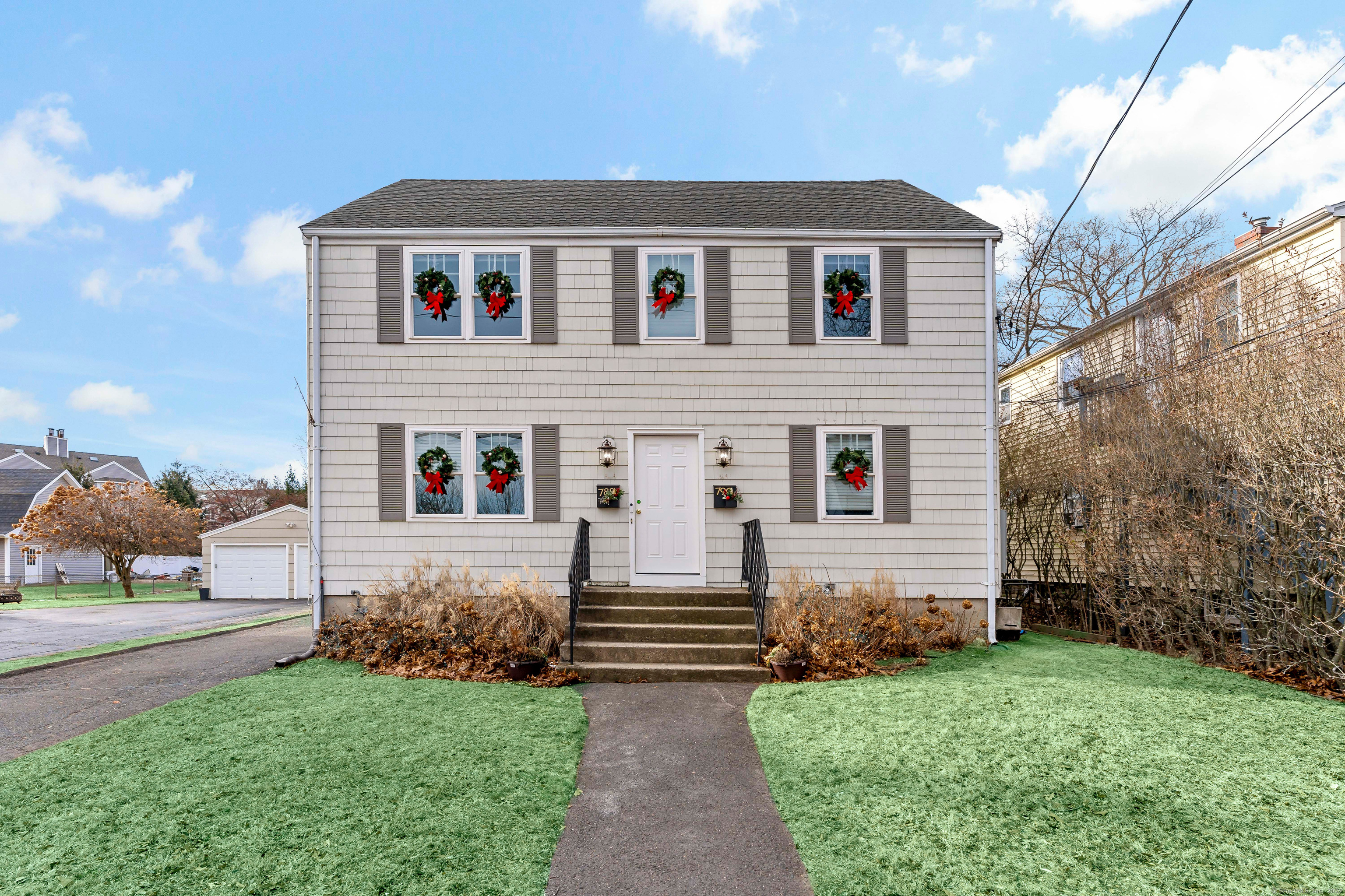 788 Reef Road Fairfield, CT 06824 - Photo 2 of 17 a front view of house with yard