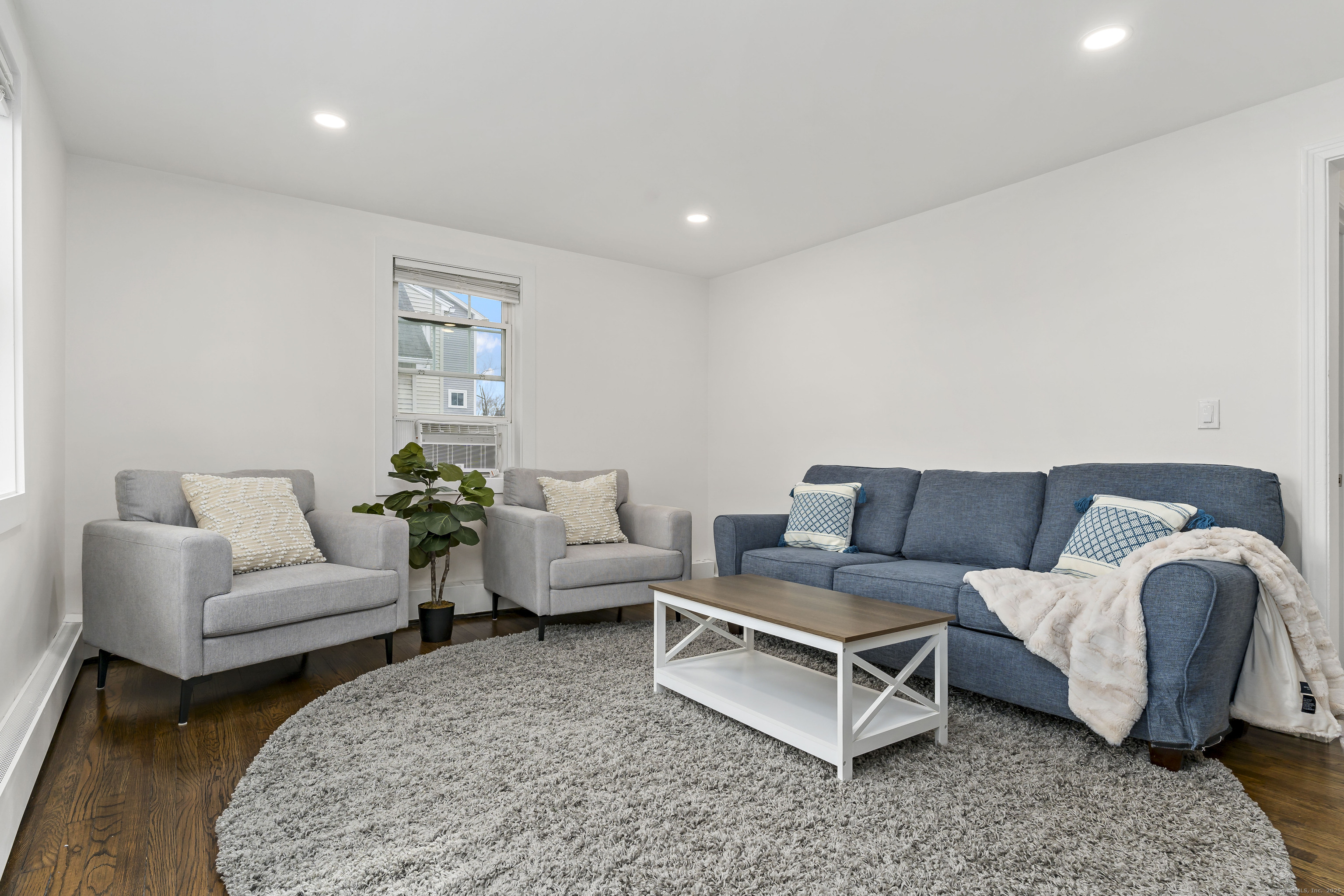 788 Reef Road Fairfield, CT 06824 - Photo 8 of 17 a living room with furniture and a couch