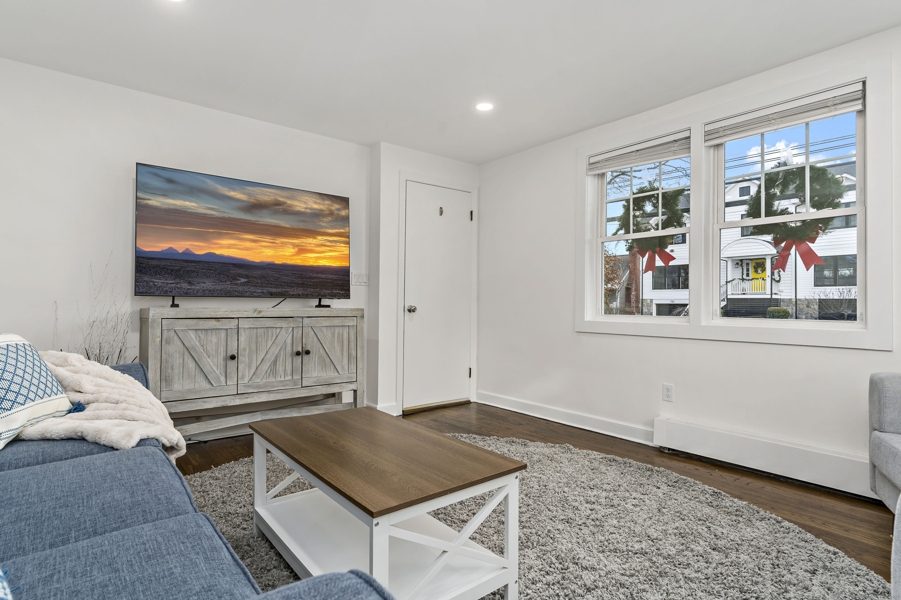 788 Reef Road Fairfield, CT 06824 - Photo 9 of 17 a living room with furniture and a flat screen tv