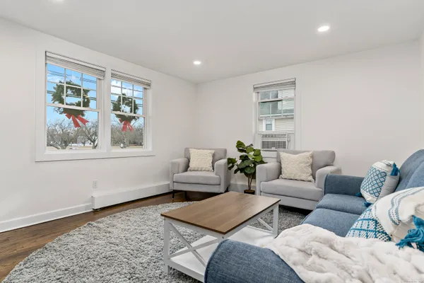 a living room with furniture and a window