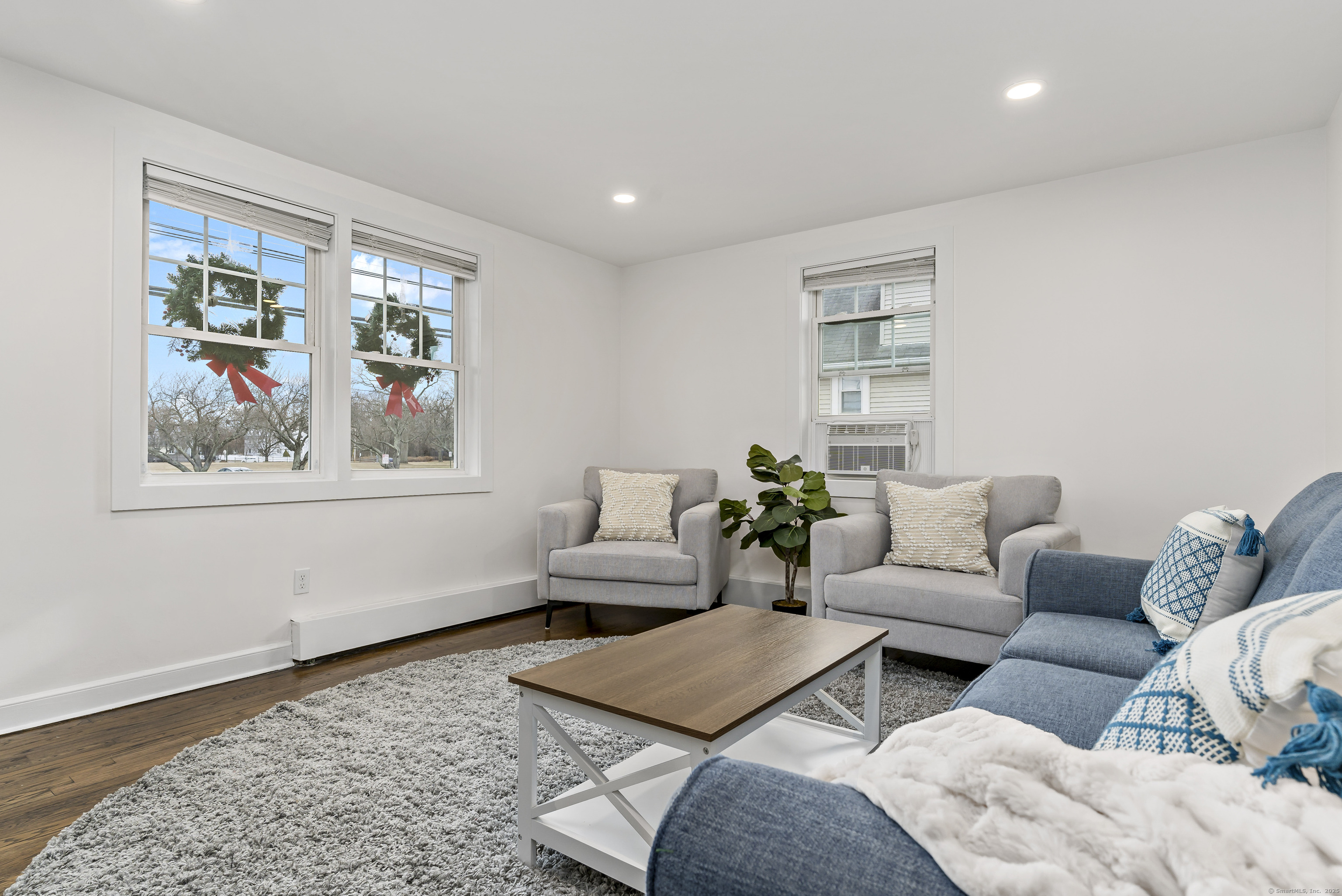 788 Reef Road Fairfield, CT 06824 - Photo 10 of 17 a living room with furniture and a window
