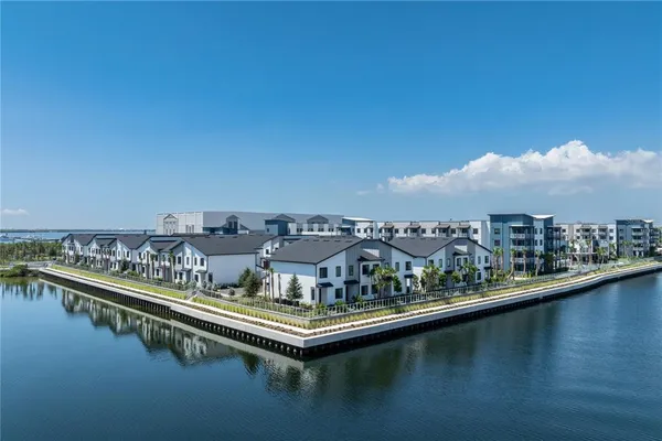 a view of a city with tall buildings in ocean