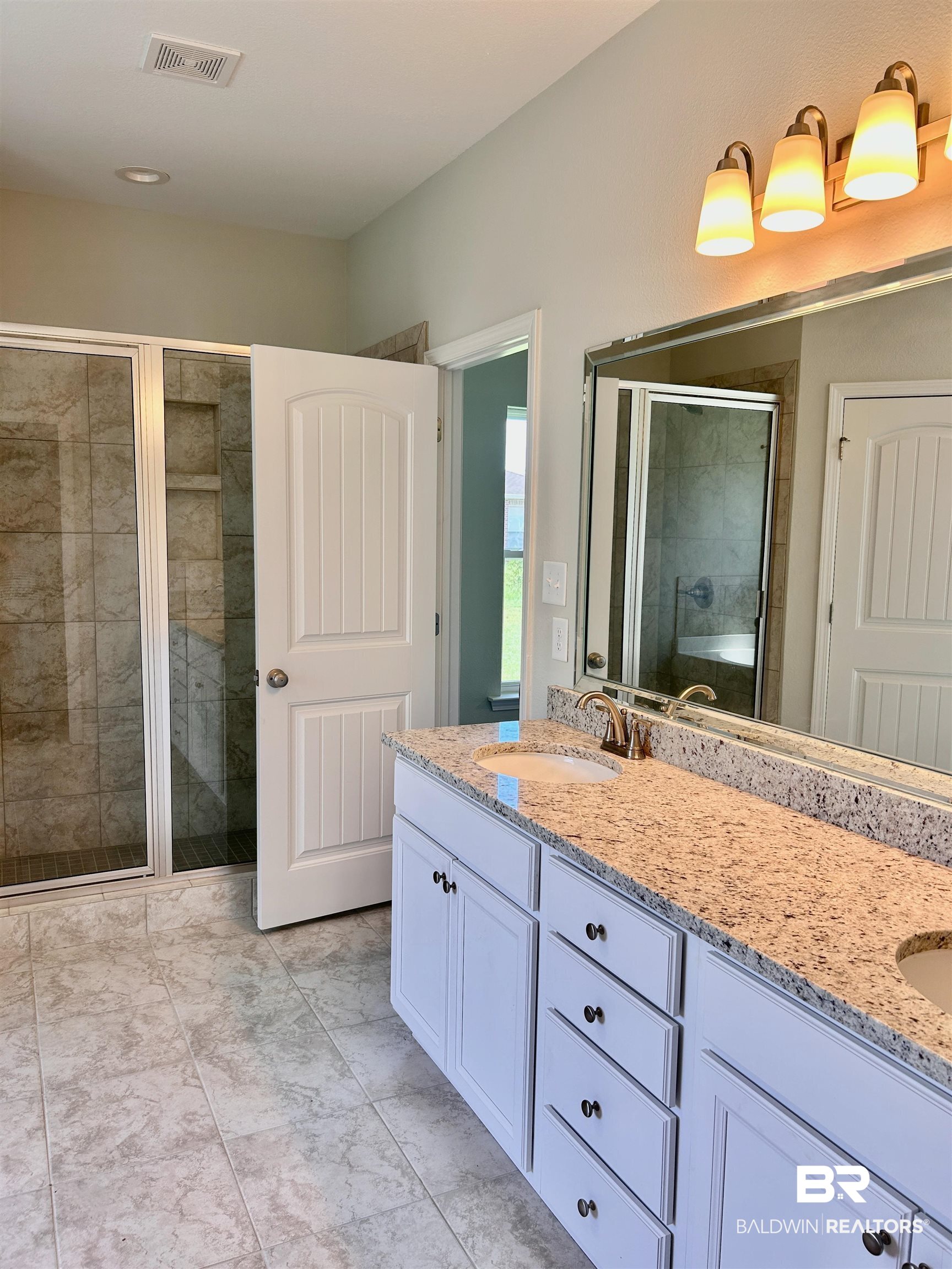 1267 Pembroke Way Foley, AL 36535 - Photo 16 of 17 Bathroom with vanity and a shower with door