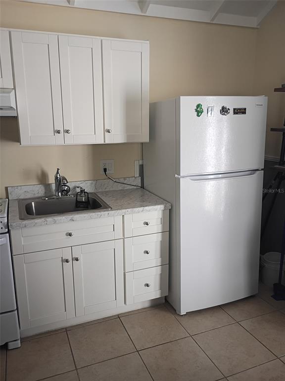 1622 9th Street, Unit B Sarasota, FL 34236 - Photo 6 of 15 a white refrigerator freezer sitting in a kitchen