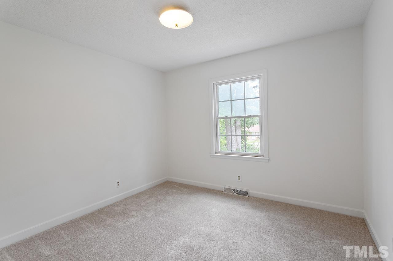 6407 Amhurst Road Durham, NC 27713 - Photo 20 of 28 an empty room with a window