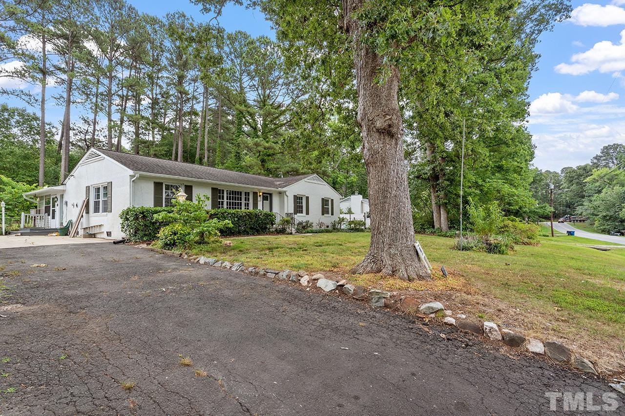 6407 Amhurst Road Durham, NC 27713 - Photo 2 of 28 a view of a house with backyard and garden
