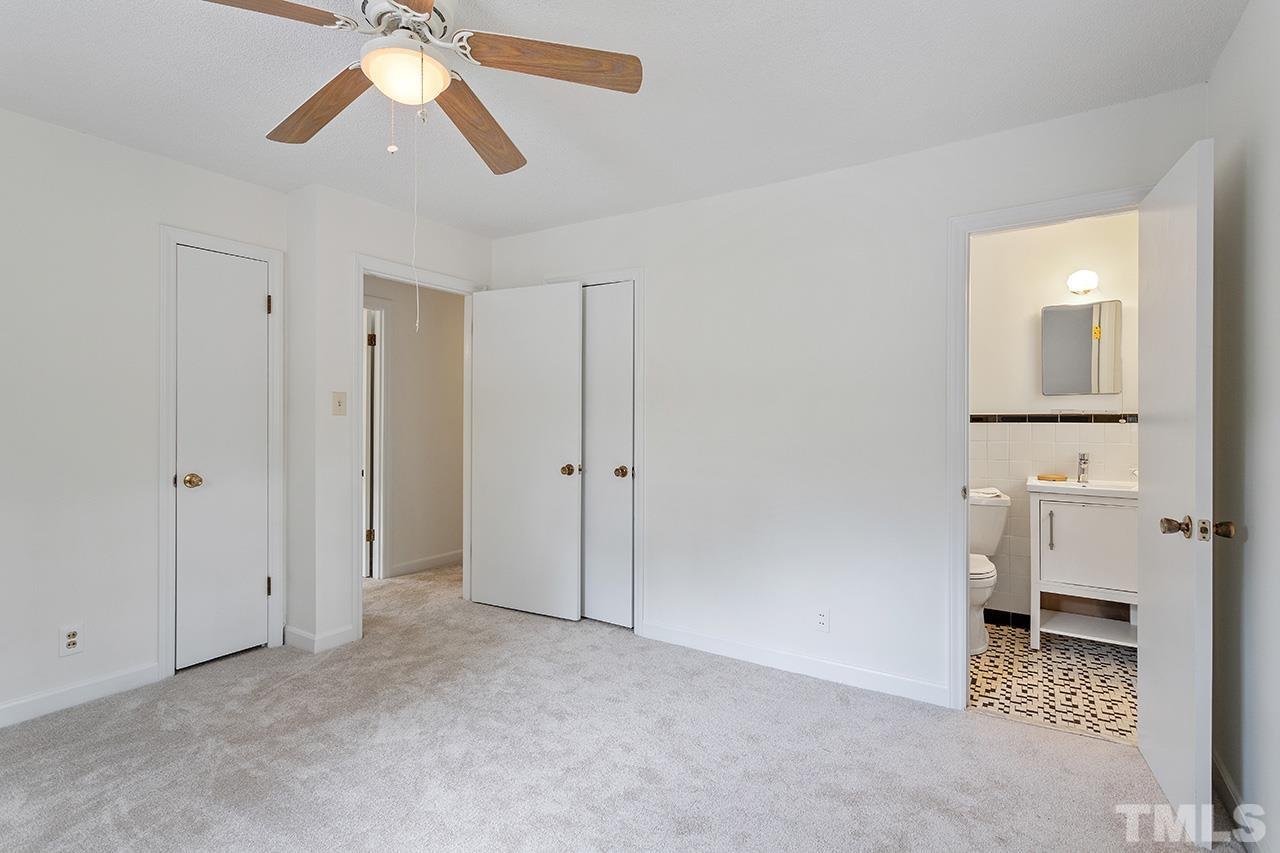 6407 Amhurst Road Durham, NC 27713 - Photo 22 of 28 an empty room with windows and fan