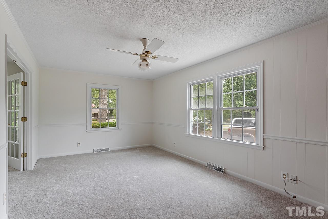 6407 Amhurst Road Durham, NC 27713 - Photo 10 of 28 a view of an empty room with a window