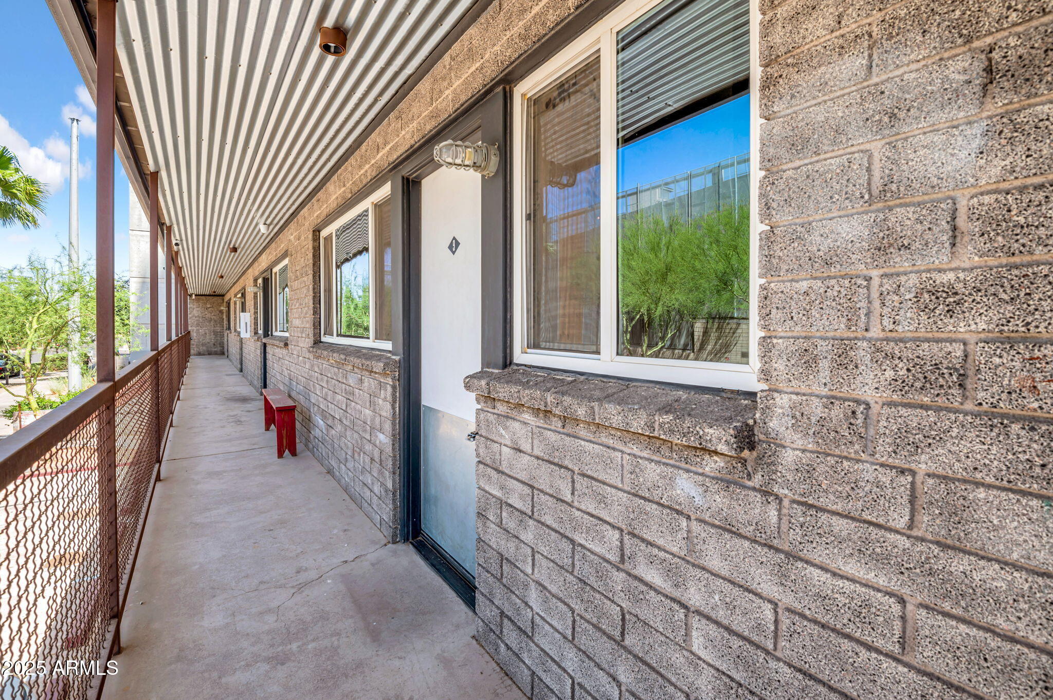 821 North 3rd Street, Unit 9 Phoenix, AZ 85004 - Photo 3 of 15 a view of a porch with a floor to ceiling window