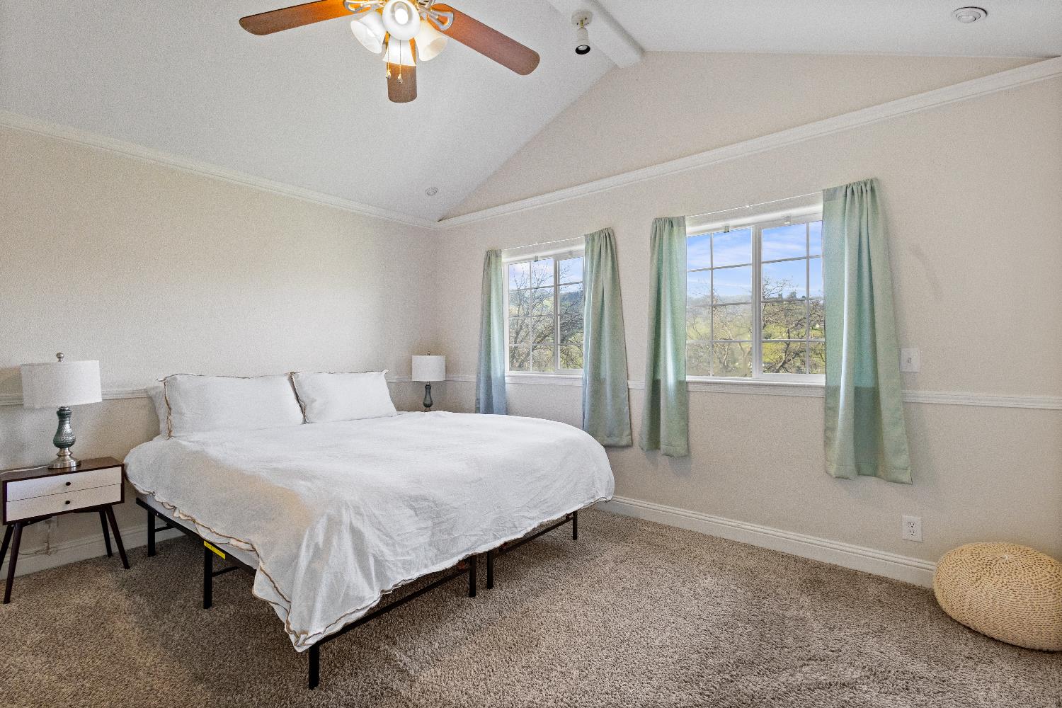 35171 Sand Creek Road Squaw Valley, CA 93675 - Photo 12 of 34 a bedroom with a large bed and a chandelier fan