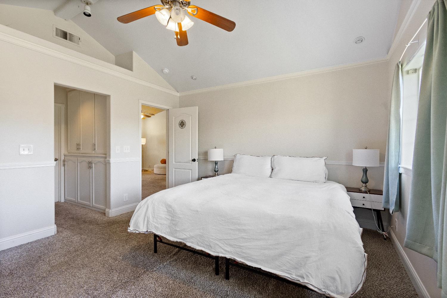 35171 Sand Creek Road Squaw Valley, CA 93675 - Photo 14 of 35 a bedroom with a bed and a chandelier