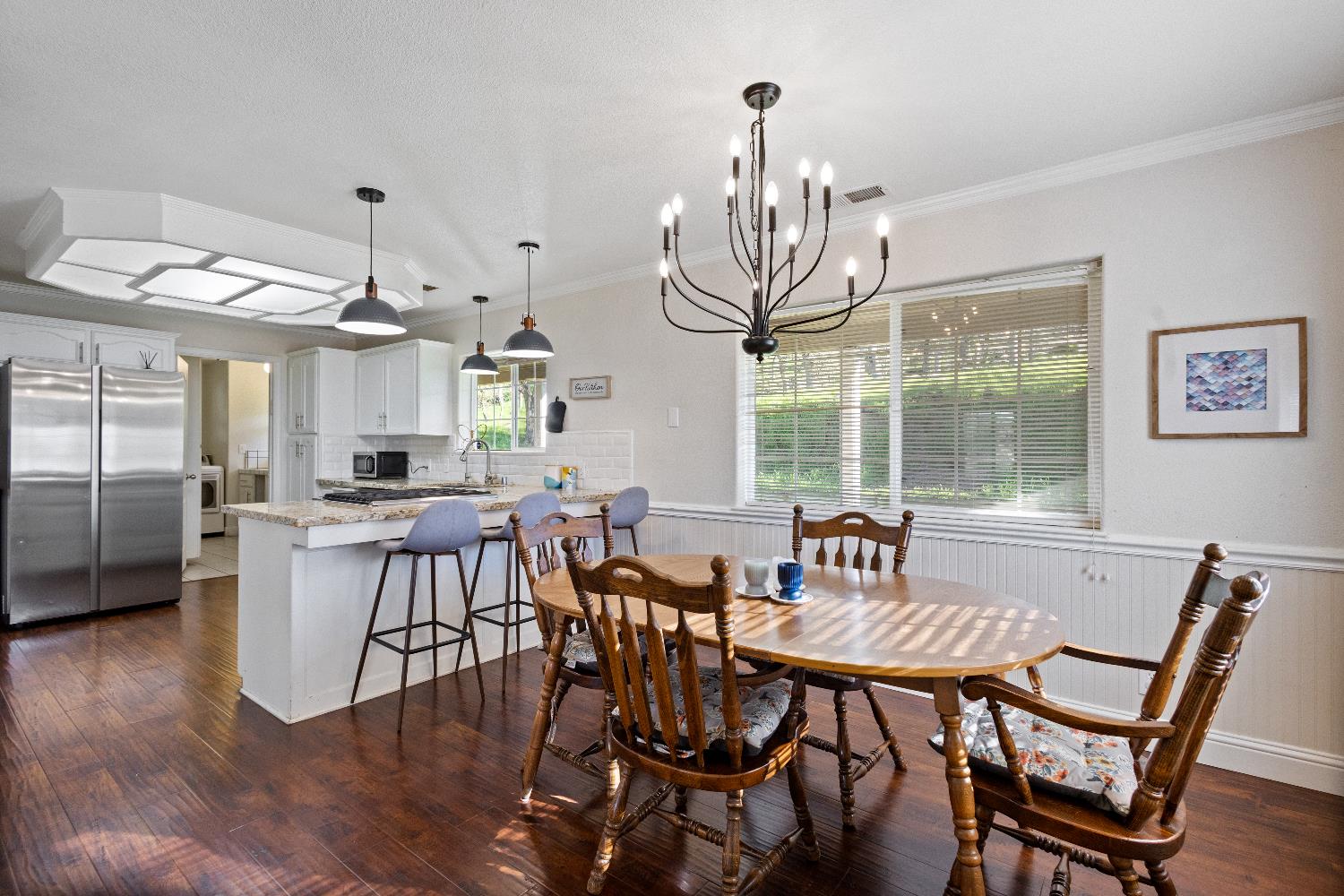 35171 Sand Creek Road Squaw Valley, CA 93675 - Photo 6 of 35 a view of a dining room with furniture wooden floor and chandelier