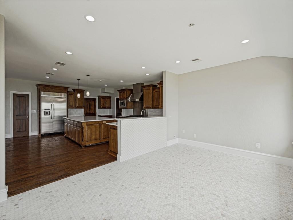 5975 Diamond Spur Frisco, TX 75036 - Photo 13 of 40 a view of kitchen with refrigerator and microwave