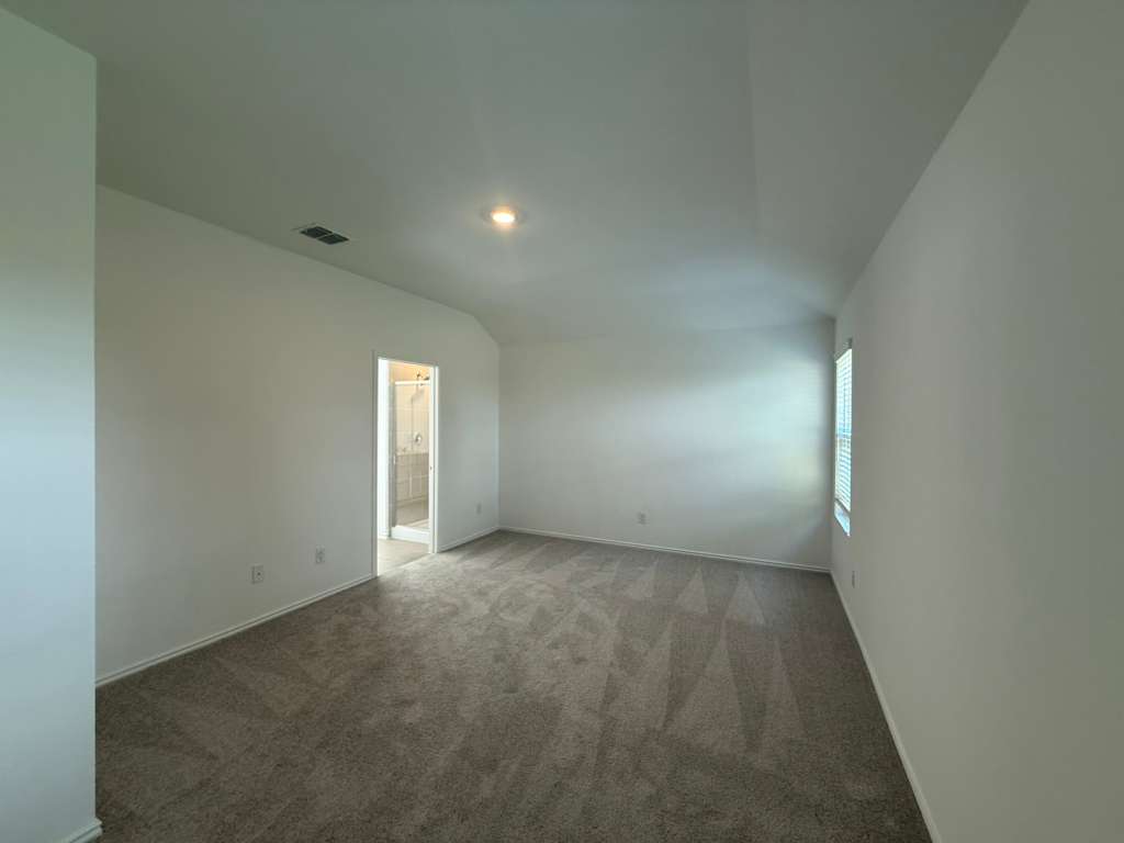 623 Sormonne Loop Kyle, TX 78640 - Photo 25 of 40 Carpeted spare room featuring baseboards