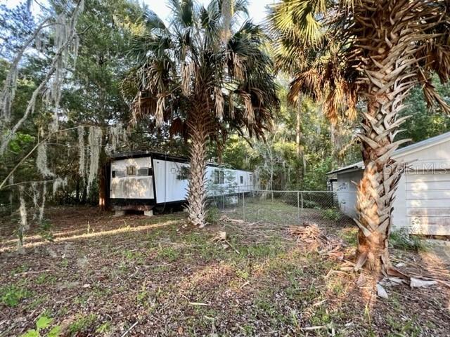 1010 South Main Street Bell, FL 32619 - Photo 5 of 14 a backyard of a house with lots of green space