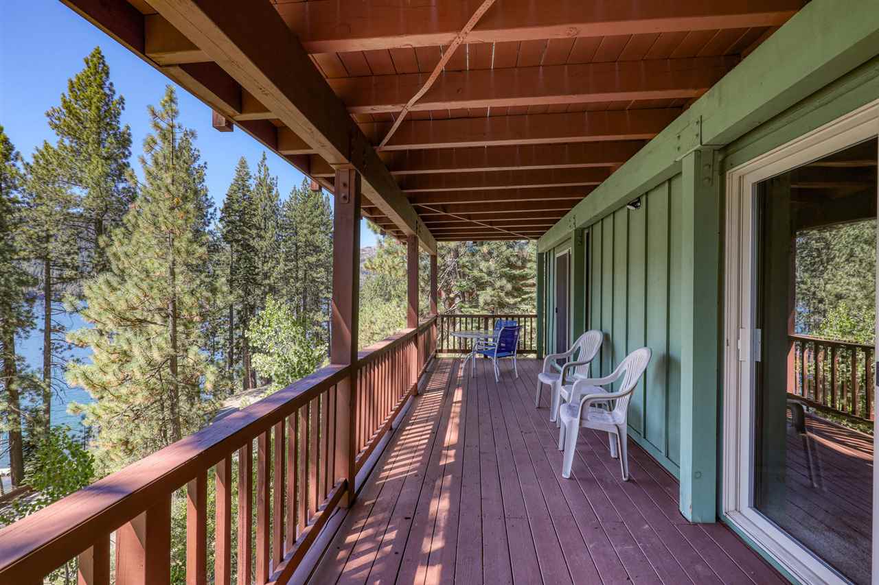 14300 Donner Pass Road Truckee, CA 96161 - Photo 14 of 20 a balcony with wooden furniture and outdoor seating