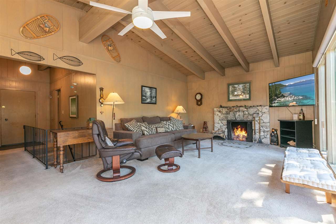 14300 Donner Pass Road Truckee, CA 96161 - Photo 5 of 20 a living room with furniture and a fireplace
