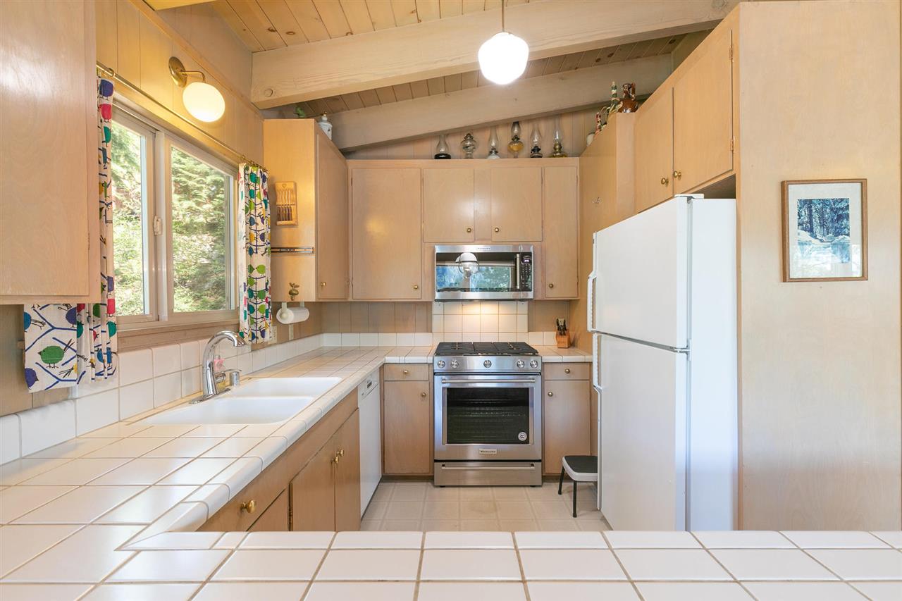 14300 Donner Pass Road Truckee, CA 96161 - Photo 8 of 20 a kitchen with stainless steel appliances a refrigerator sink and stove
