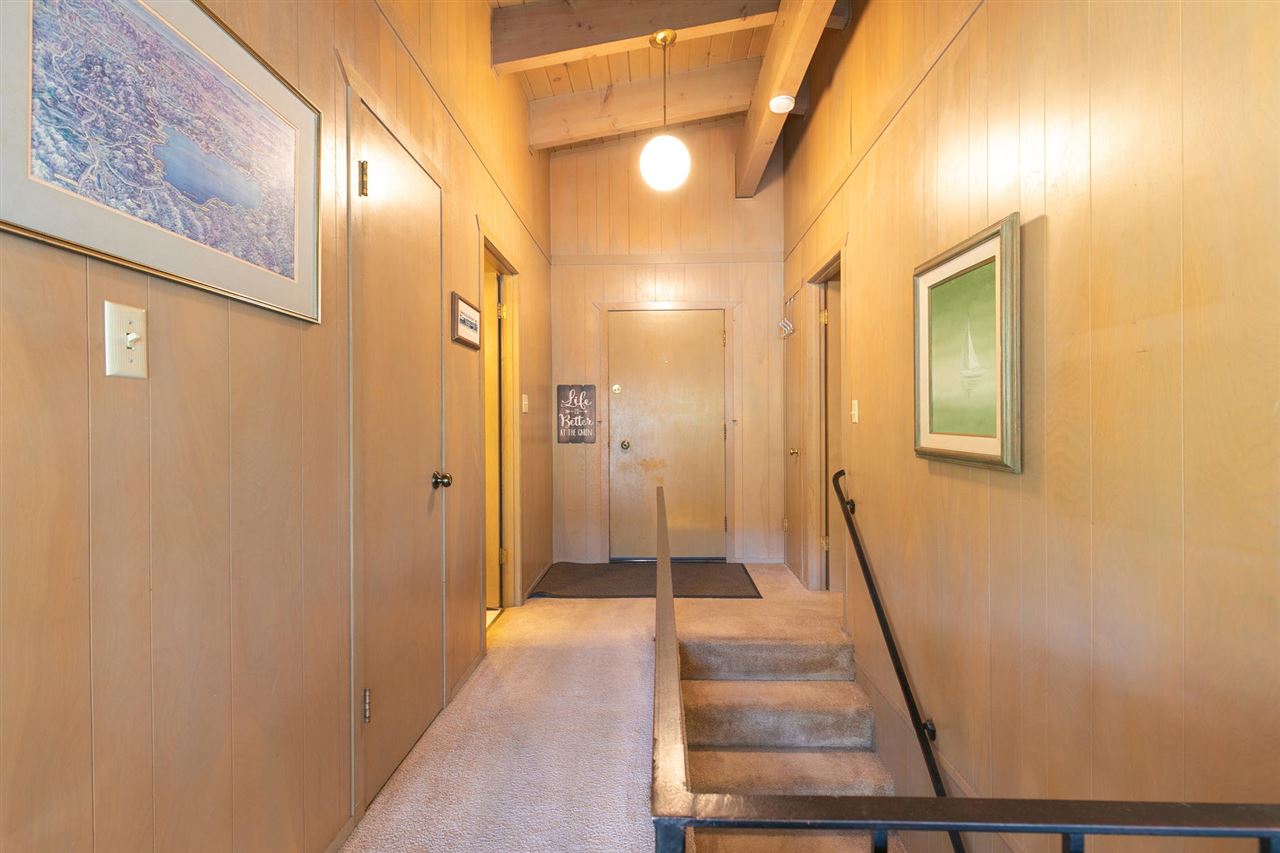 14300 Donner Pass Road Truckee, CA 96161 - Photo 9 of 20 a view of a hallway with a door and a glass door