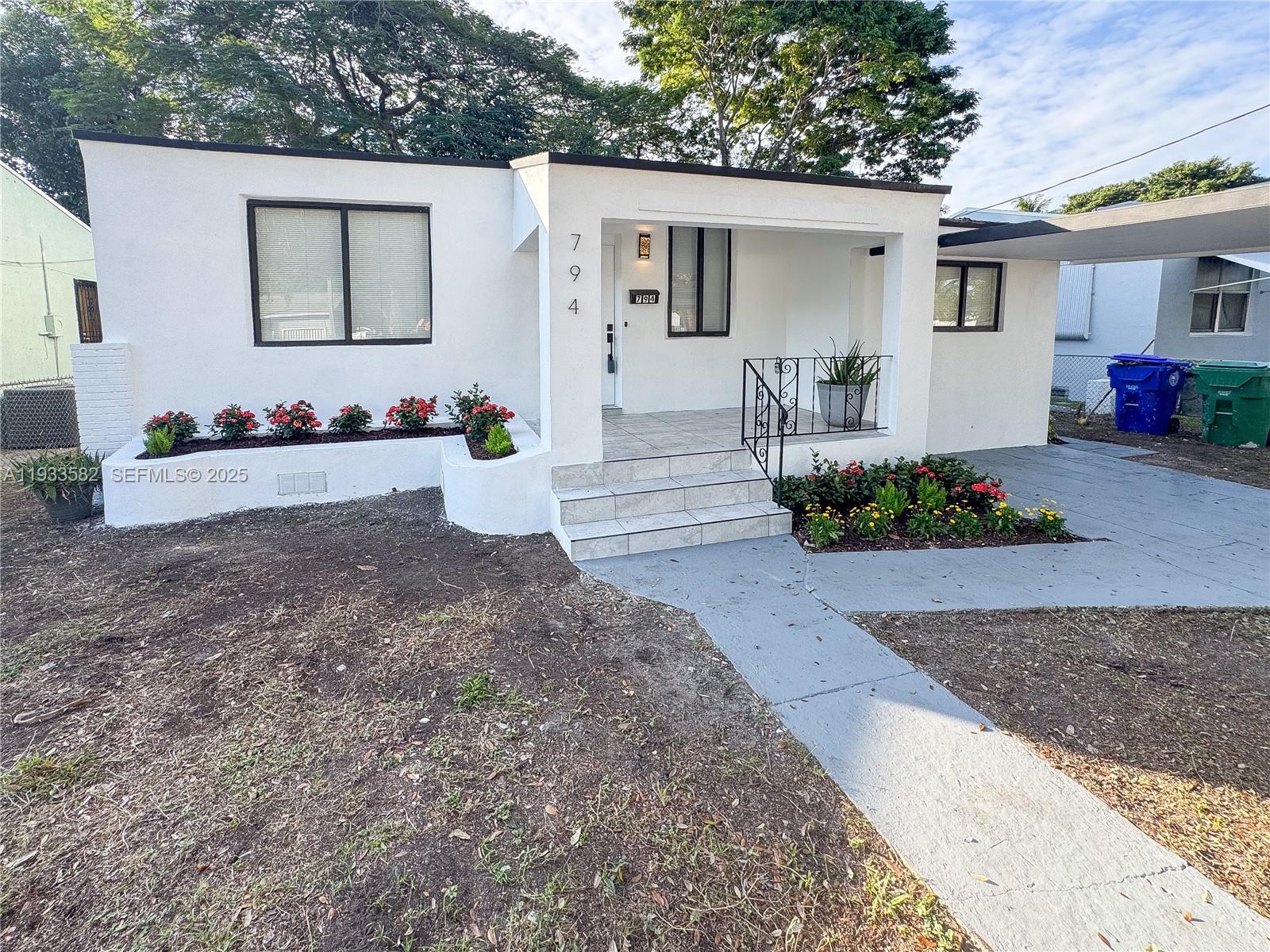 794 Northwest 44th Street Miami, FL 33127 - Photo 1 of 31 a view of backyard of the house