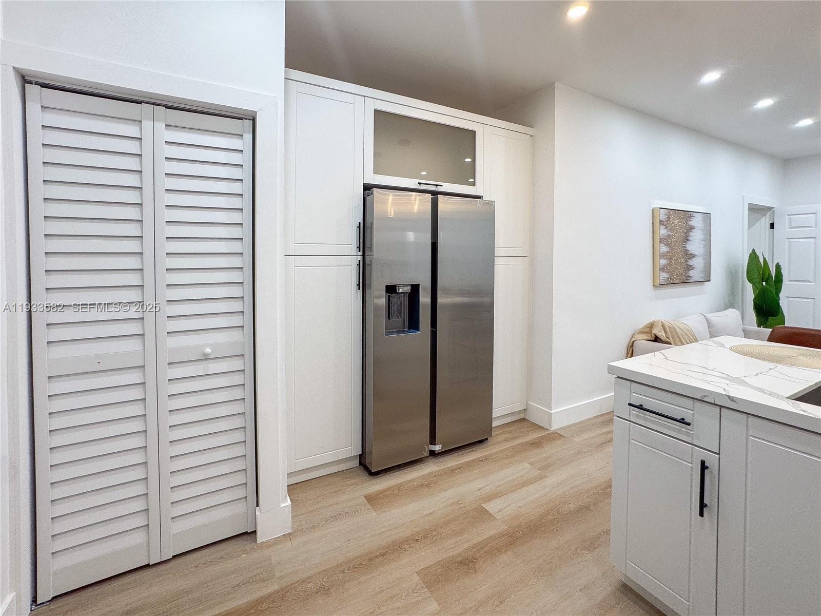 794 Northwest 44th Street Miami, FL 33127 - Photo 14 of 31 a kitchen with stainless steel appliances granite countertop a refrigerator and a sink