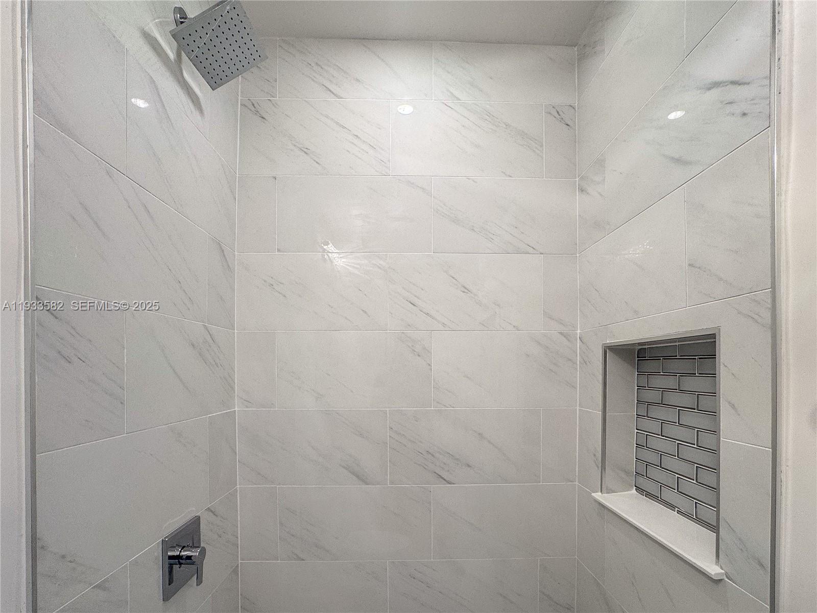 794 Northwest 44th Street Miami, FL 33127 - Photo 15 of 31 a bathroom with a shower