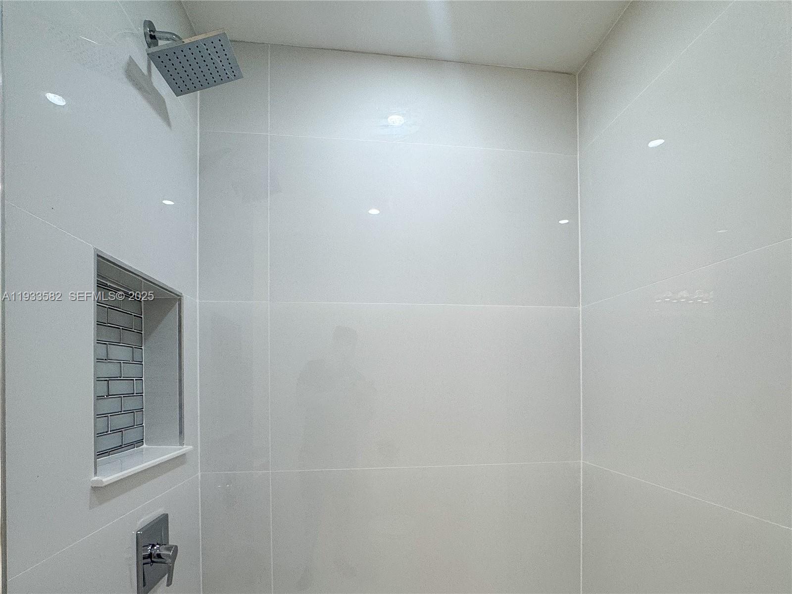 794 Northwest 44th Street Miami, FL 33127 - Photo 17 of 31 a bathroom with a shower