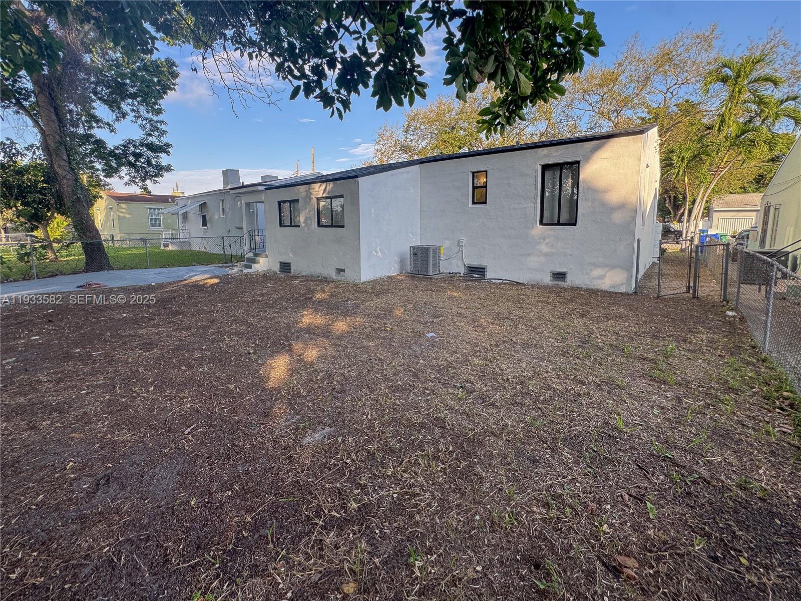 794 Northwest 44th Street Miami, FL 33127 - Photo 29 of 31 a view of a house with a backyard