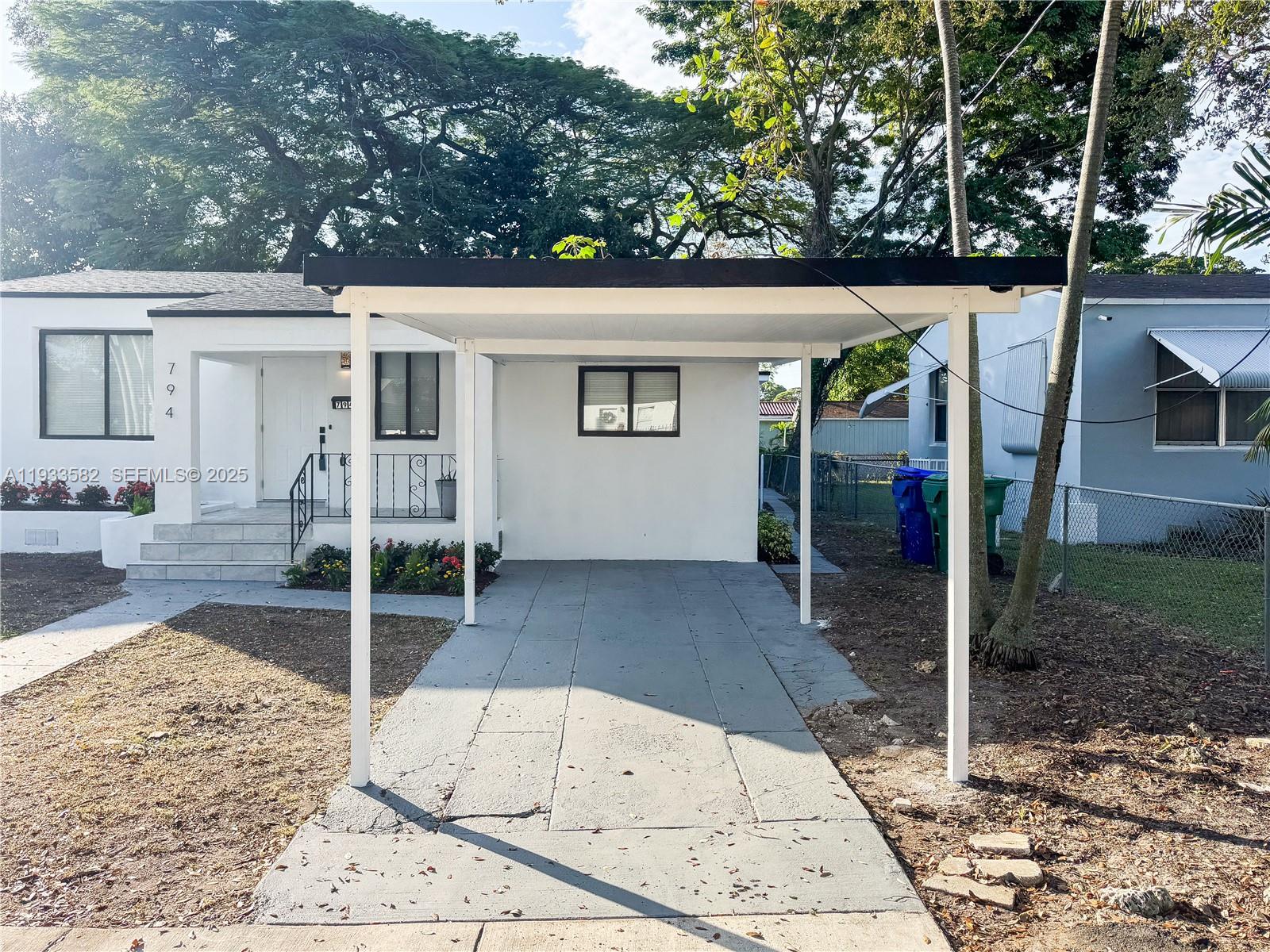794 Northwest 44th Street Miami, FL 33127 - Photo 4 of 31 a view of a porch