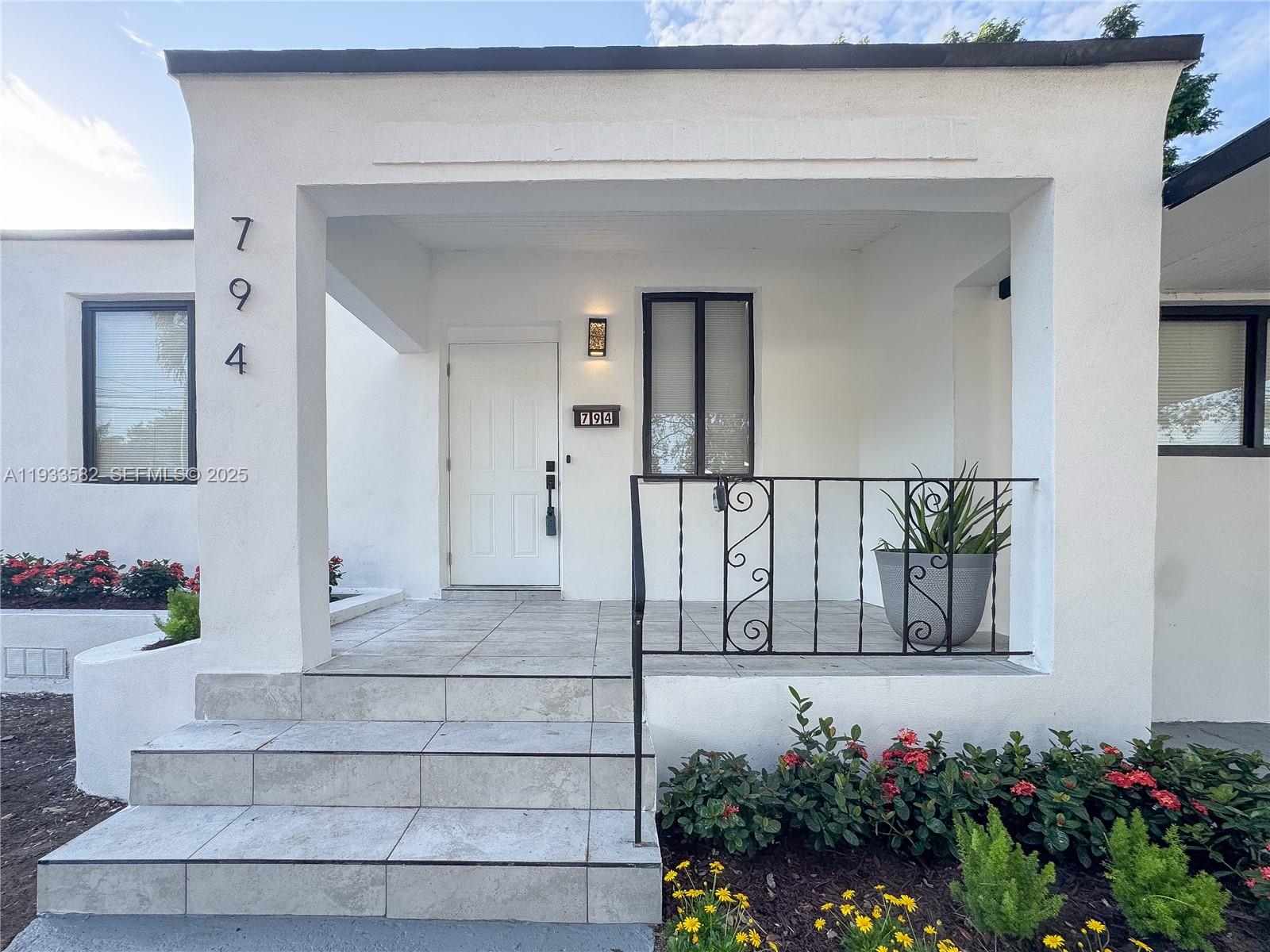 794 Northwest 44th Street Miami, FL 33127 - Photo 5 of 31 a view of a entryway door front of house