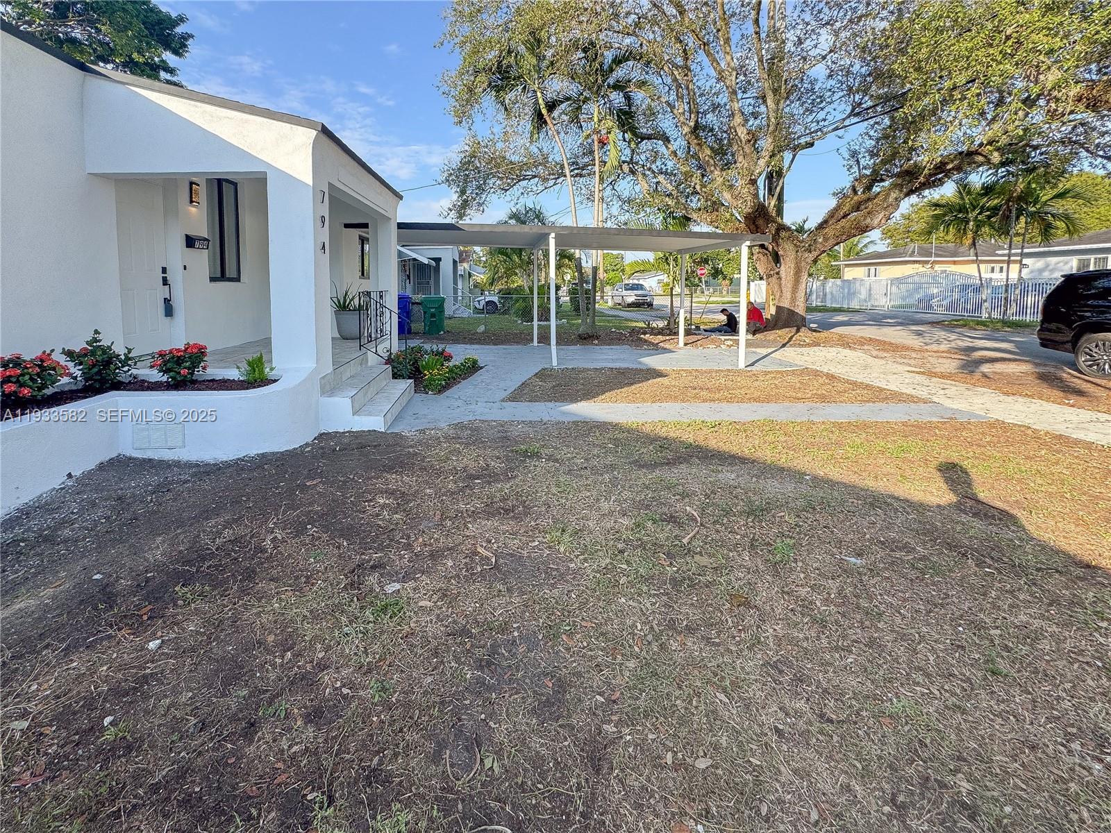 794 Northwest 44th Street Miami, FL 33127 - Photo 6 of 31 a view of road with trees