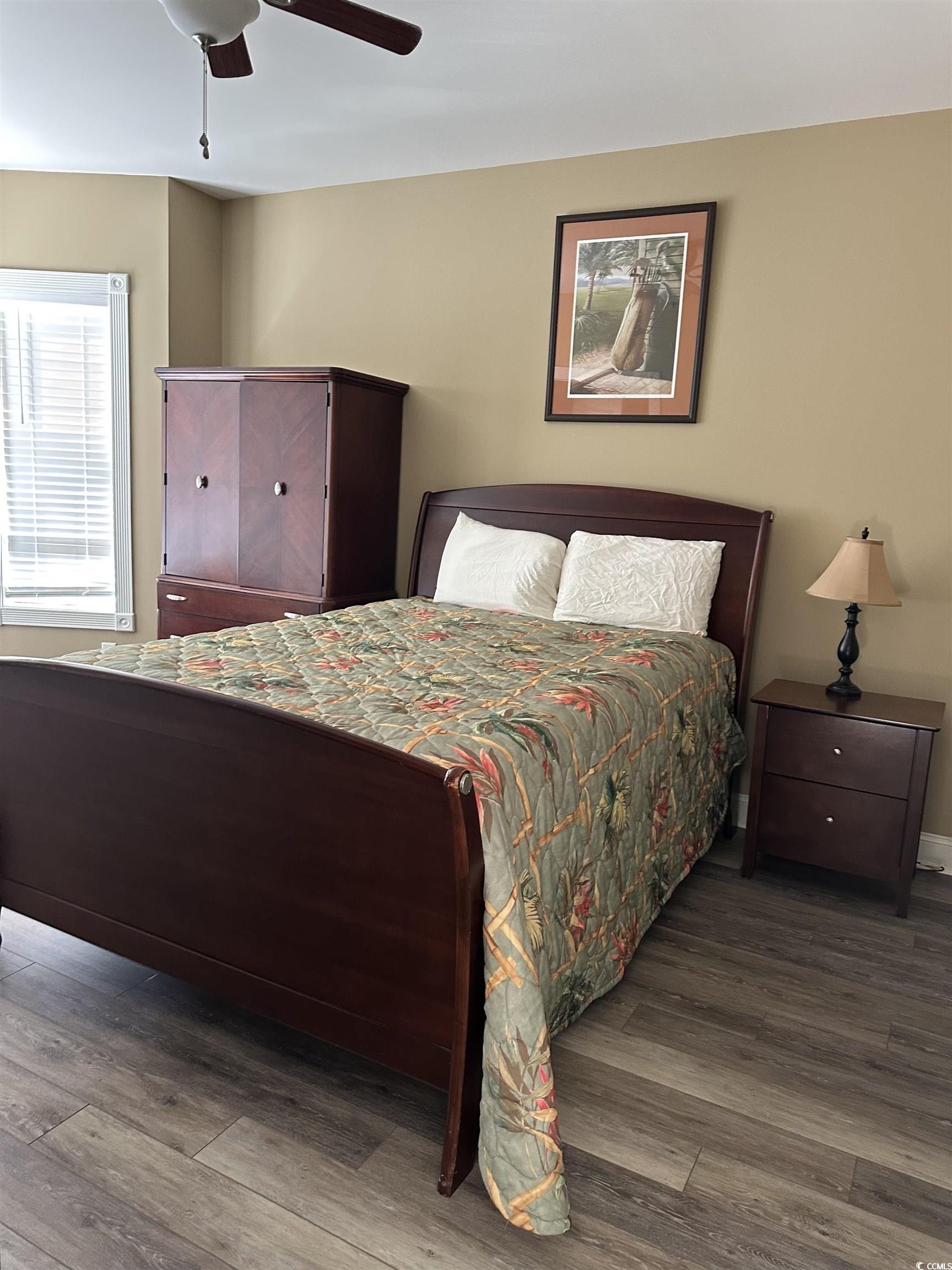 4811 Magnolia Lake Drive, Unit 302 Myrtle Beach, SC 29577 - Photo 15 of 39 Bedroom featuring a ceiling fan and wood finished floors
