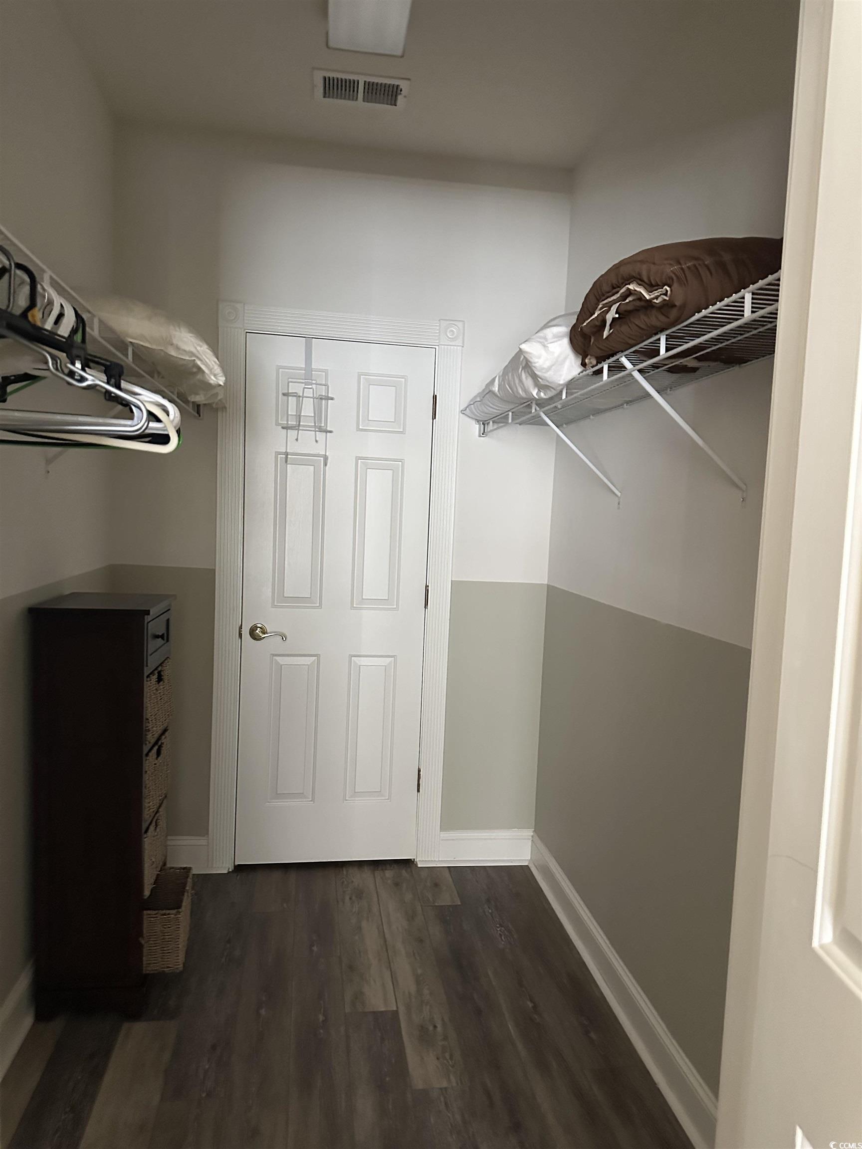 4811 Magnolia Lake Drive, Unit 302 Myrtle Beach, SC 29577 - Photo 16 of 39 Spacious closet with dark wood finished floors