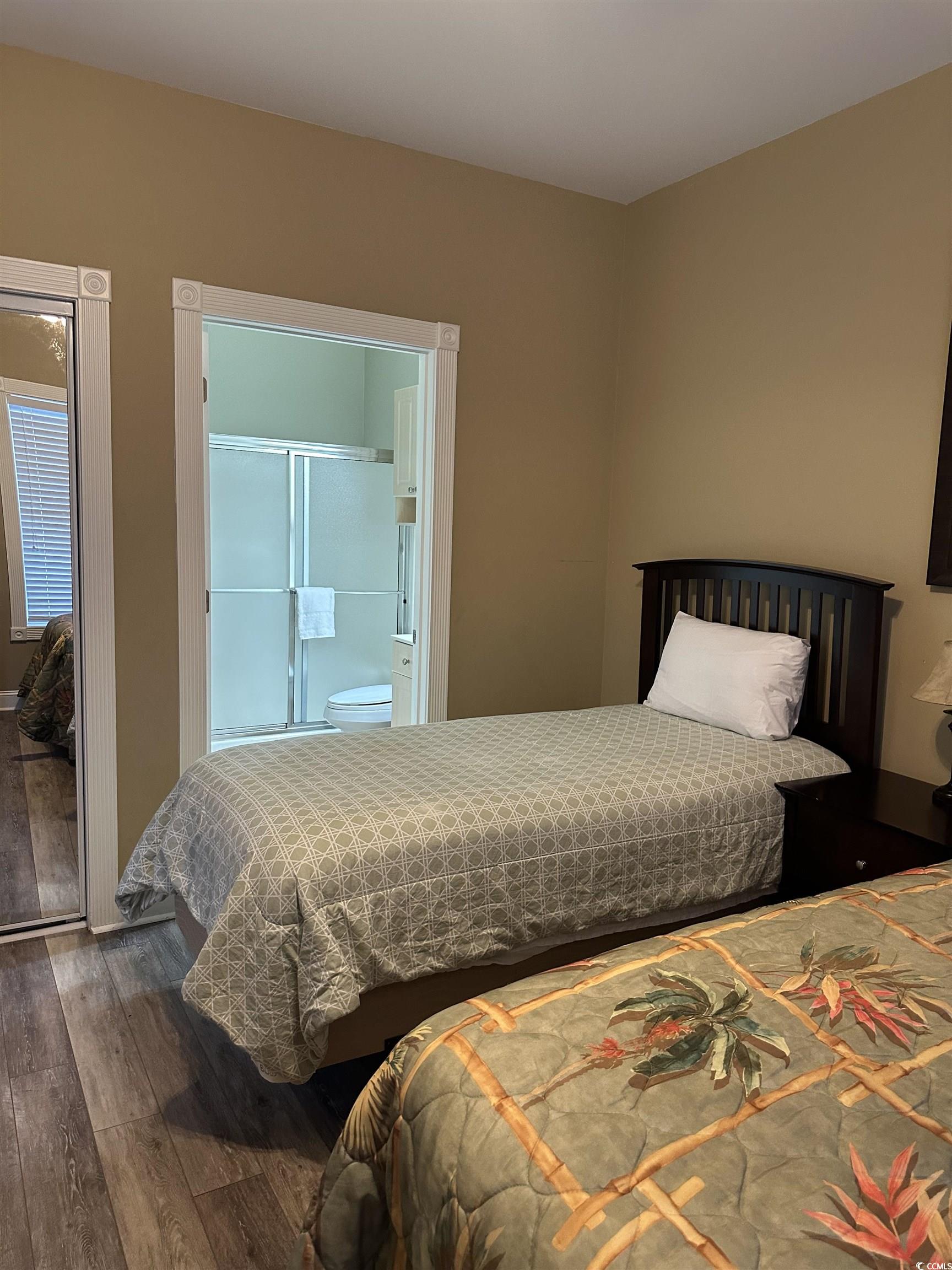 4811 Magnolia Lake Drive, Unit 302 Myrtle Beach, SC 29577 - Photo 20 of 39 Bedroom featuring wood-type flooring
