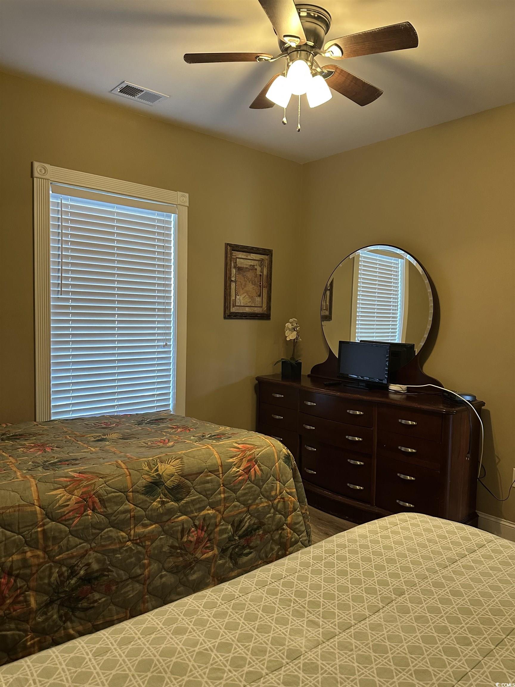 4811 Magnolia Lake Drive, Unit 302 Myrtle Beach, SC 29577 - Photo 21 of 39 Bedroom with a ceiling fan
