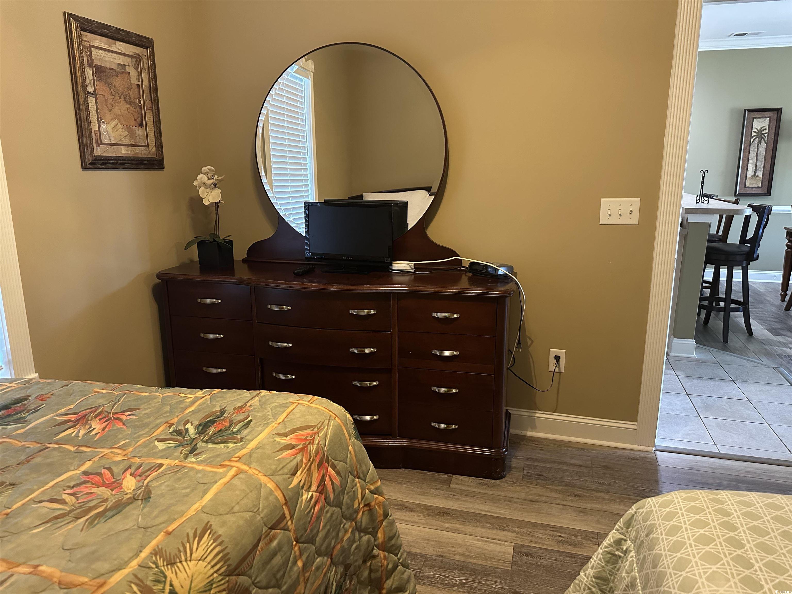 4811 Magnolia Lake Drive, Unit 302 Myrtle Beach, SC 29577 - Photo 22 of 39 Bedroom with baseboards and wood finished floors