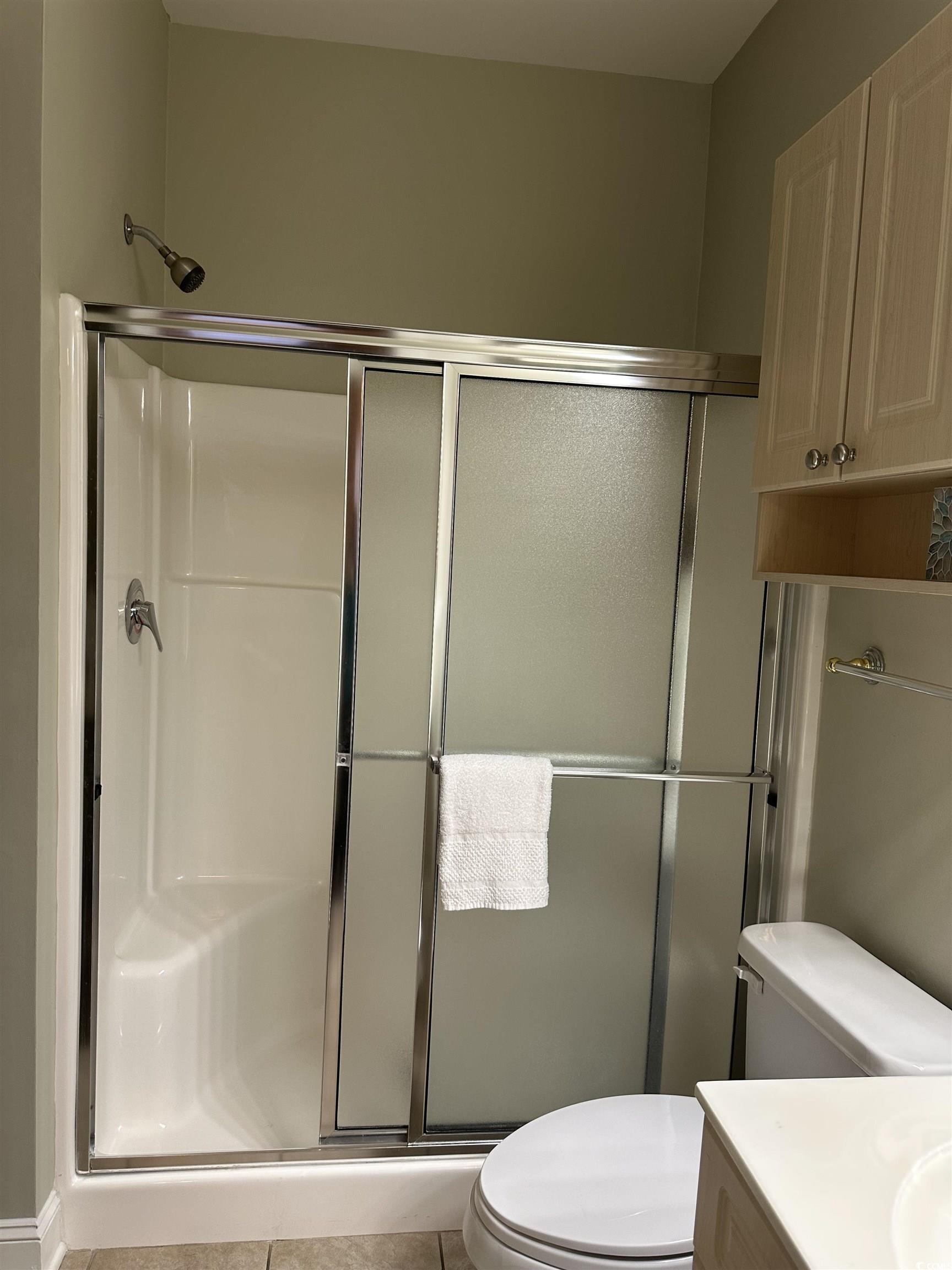 4811 Magnolia Lake Drive, Unit 302 Myrtle Beach, SC 29577 - Photo 24 of 39 Full bathroom with vanity, a stall shower, and light tile patterned floors