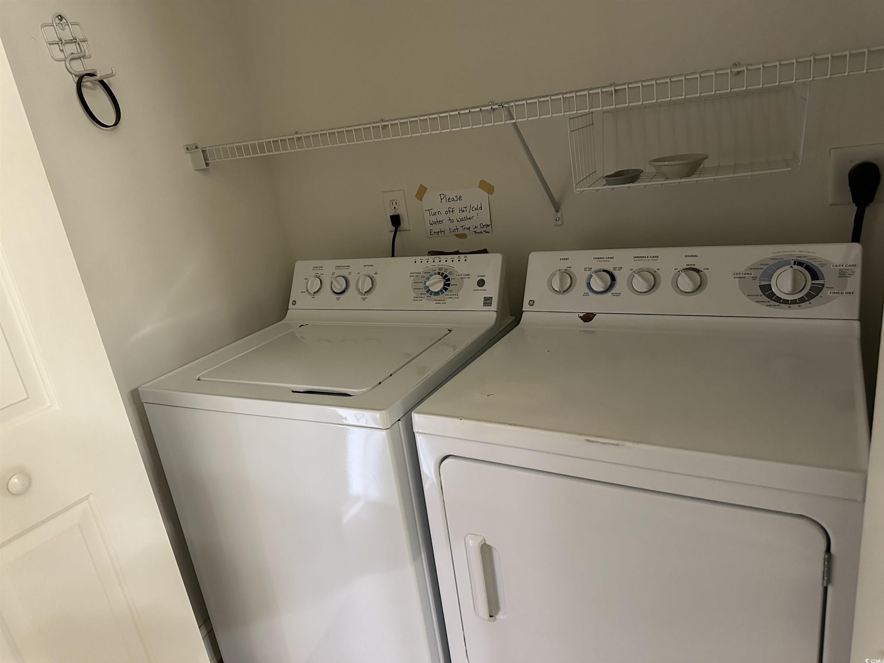 4811 Magnolia Lake Drive, Unit 302 Myrtle Beach, SC 29577 - Photo 25 of 39 Laundry area with washing machine and dryer