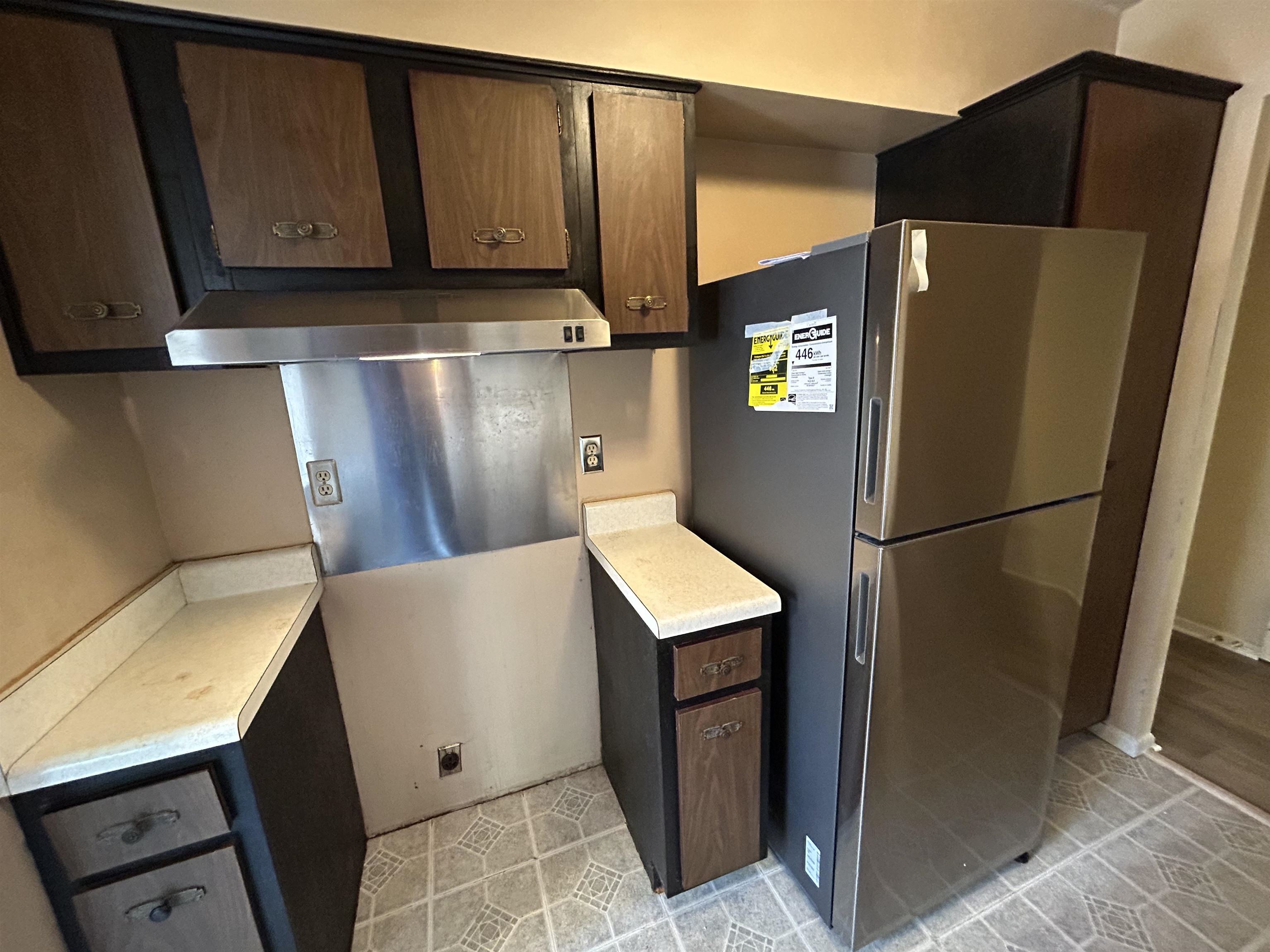 2800 Clarke Road, Unit 2 Memphis, TN 38115 - Photo 10 of 18 Stainless steel refrigerator and range hood complement the kitchen's existing cabinetry