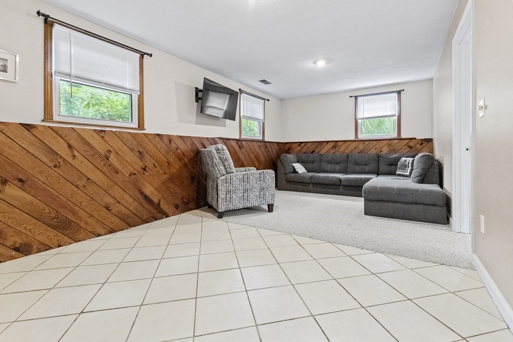 28 Edgewood Road Holbrook, MA 02343 - Photo 17 of 29 a living room with a couch and a large window