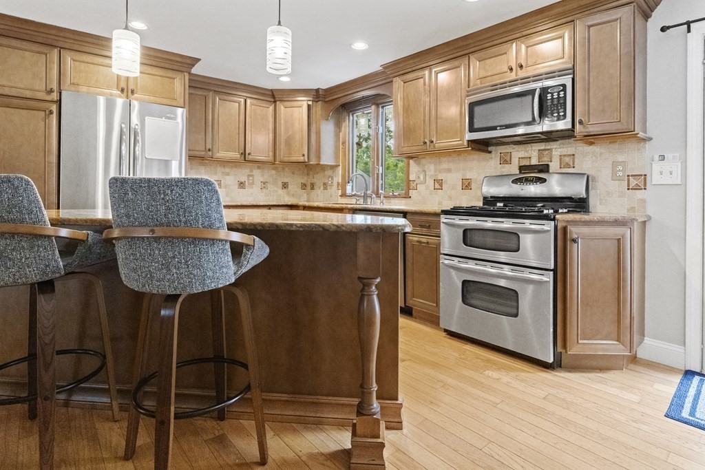 28 Edgewood Road Holbrook, MA 02343 - Photo 6 of 29 a kitchen with stainless steel appliances granite countertop a stove a sink and a microwave